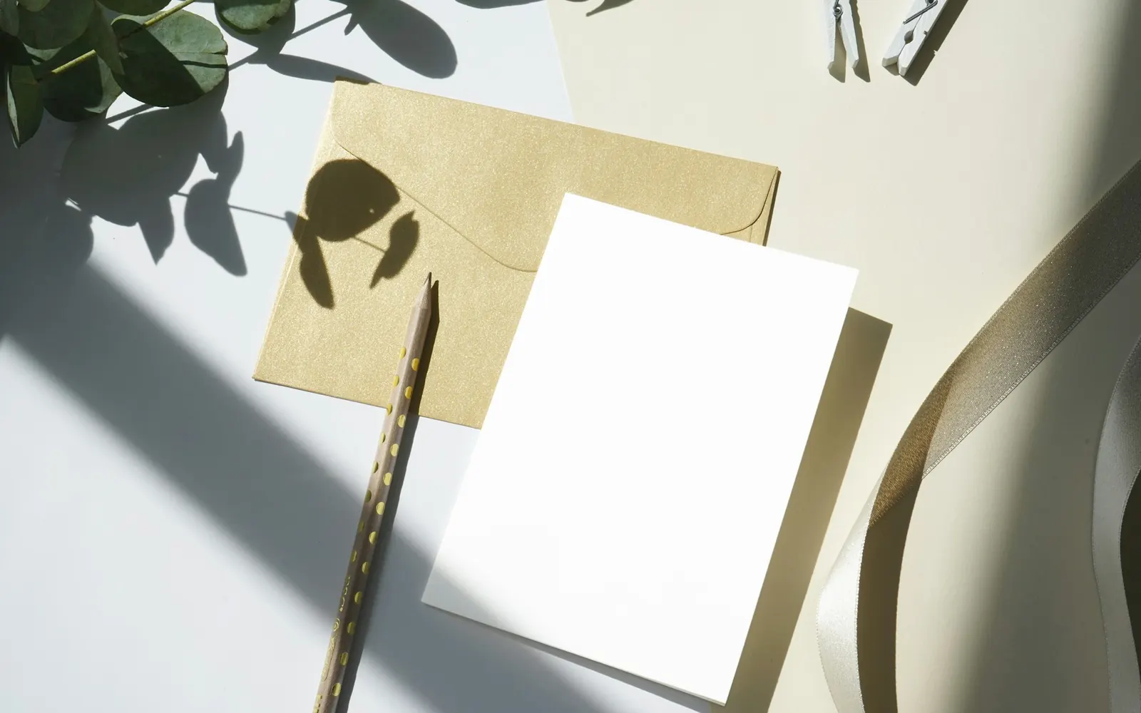 Illustrative photo: a kraft envelope, a blank card and a pencil in window light. Not a sample of the Email Marketing Sequence deliverable.